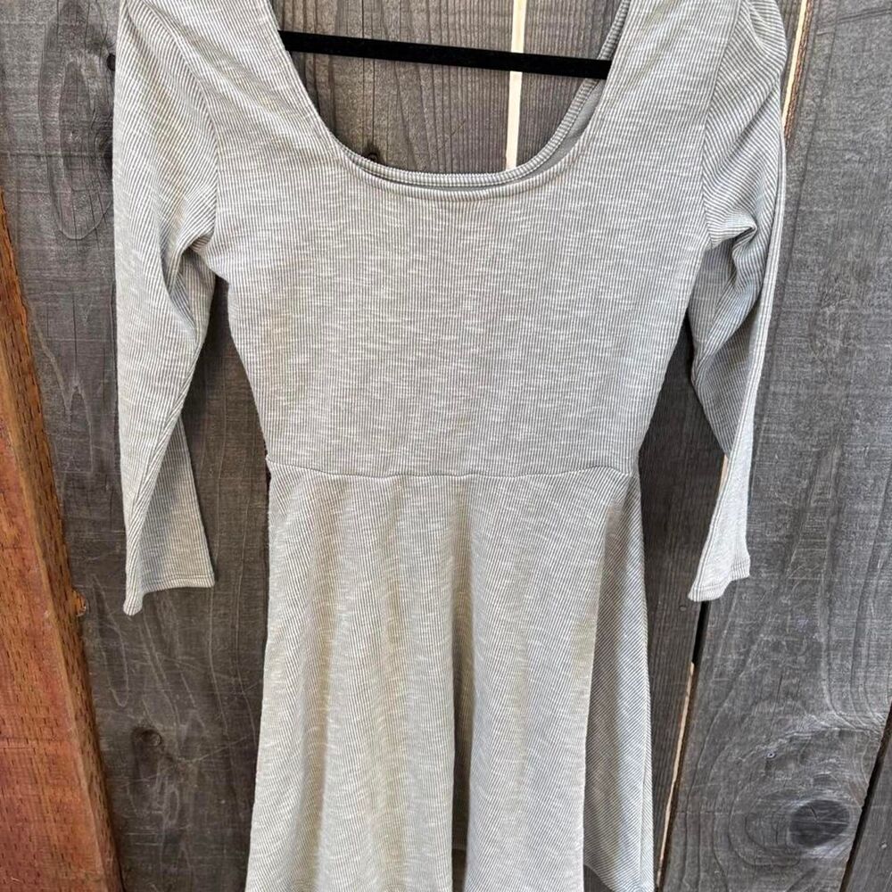 H.I.P brand Gray ribbed knit long sleeve top with a flared bottom, size M